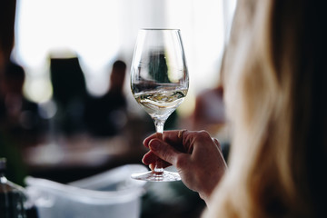 Glass of rose and white wine seen in close hand.