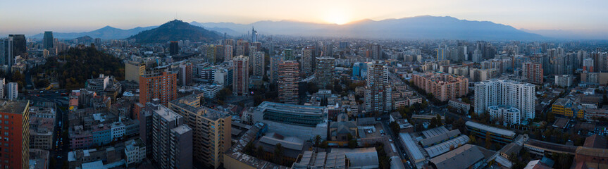 Aerial panorama of the city of Santiago de Chile during sunrise. Chile.