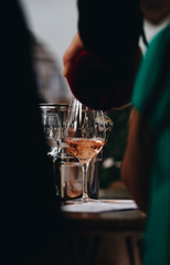 Glass of rose and white wine seen in close hand.