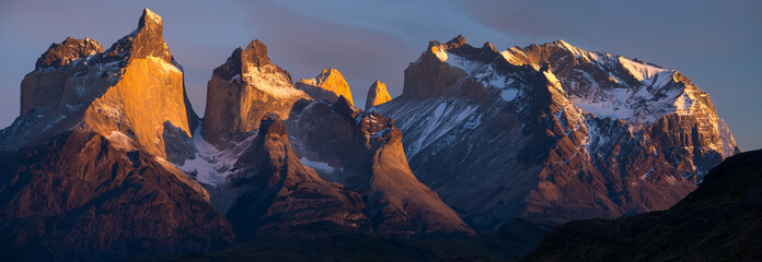 Torres del Paine National Park with snow capped mountains (Cordillera Paine) at sunrise. Chile