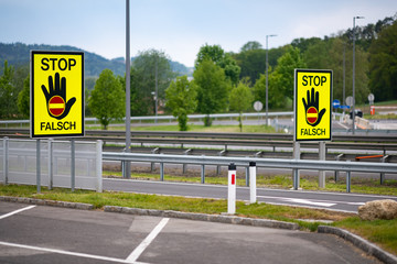 Empty highway in the austrian countryside with the STOP/ FALSCH (stop / false) sign to warn the...