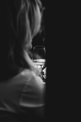 Glass of rose and white wine seen in close hand.