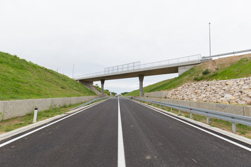 Fototapeta premium A new recently built highway in Brcko district, Bosnia and Herzegovina. The road was built by Spanish company Rubau and is important for the region