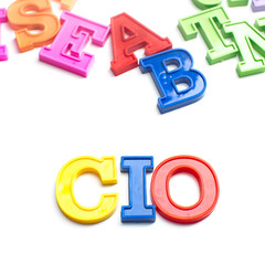 Heap of plastic colored alphabet letters close up. CIO