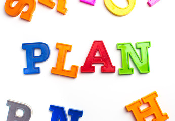 Heap of plastic colored alphabet letters close up. Plan