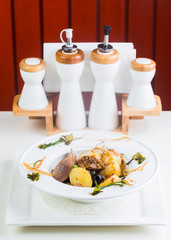 Fried potatoes with mushrooms served in a restaurant