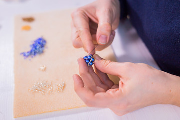 Designer making handmade eardrop