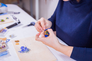 Designer making handmade brooch