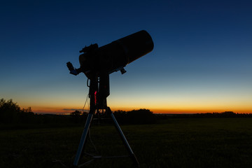 Telescope to study stars and planets is prepared for outdoor observations.