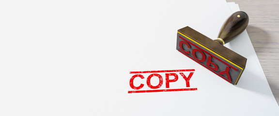 red copy stamp on white paper background