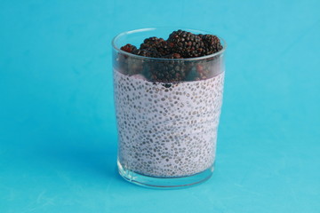 glass of chia pudding with blackberry flavor