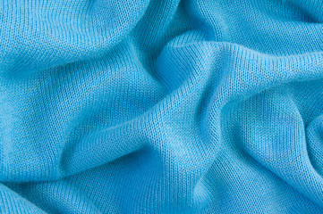 blue knitted fabric, crumpled, texture, background.