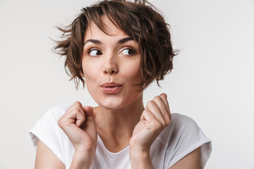 Young pretty excited shocked woman posing isolated over white wall background.
