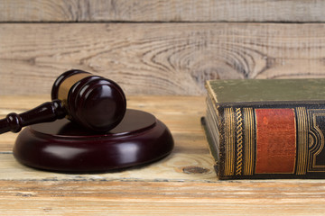 Judge gavel on the book on wooden table. justice and law concept.