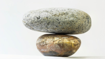 Stability concept, stone are stacked with white background