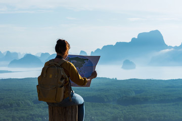 Travelers, young women are exploring the map. Landscape Beautiful Mountain on sea at Samet Nangshe Viewpoint. Phang Nga Bay ,Travel adventure, Travel Thailand, Tourist on summer holiday vacation.