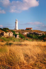Fototapeta na wymiar Lighthouse tower at sunset, Paphos, Cyprus