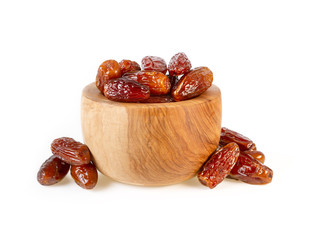 dried dates sweet palm dates in wooden cup isolated on white