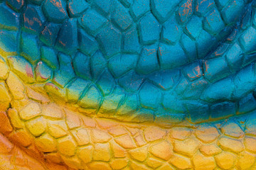 Close up to Colorful and patterns of  dinosaur model surfaces created with cement
