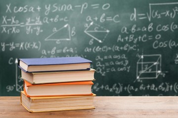 Books stack collection in a pile on wooden table