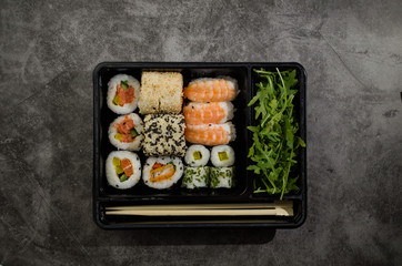 Fresh asian sushi box on the table