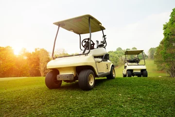 Poster Golf cart on fairway in golf course. © somchai