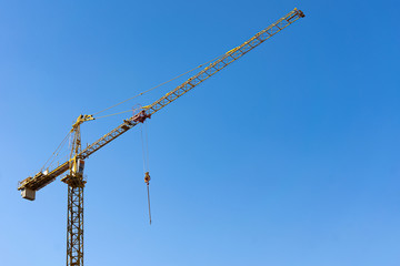 tower crane against the blue sky. copy space