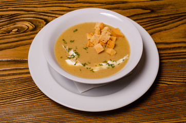 Minestrone, italian vegetable soup with pasta on wooden table. Top view