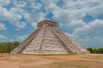 Fototapeta na wymiar Side shot of the Mayan Pyramid of Kukulkan, known as El Castillo, classified as Structure 5B18, taken in the archaeological area of Chichen Itza, in the Yucatan peninsula