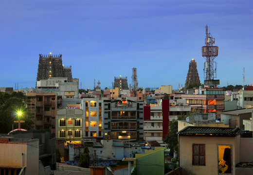 Night view of Madurai city, houses roofs and gopuras of ancient Sri Meenakshi Amman Kovil (Meenakshi Sundareswarar Temple), Tamil Nadu, India