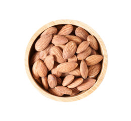 Almond seeds in a bowl isolated on white background, top view with clipping path
