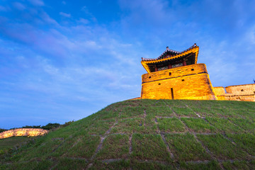 Fototapeta na wymiar Hwaseong Fortress after Sunset, Traditional Architecture of Korea at Suwon, South Korea.
