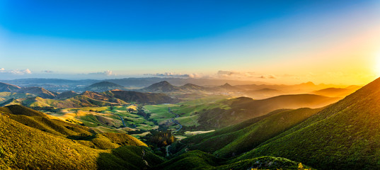 Plakat Panorama at Sunset of Mountains and Valley