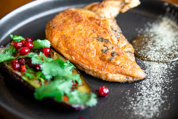 roast duck on with herbs and pomegranate seeds. summer menu
