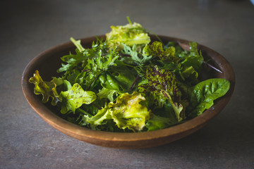 Wooden Bowl Full of Mixed Salad Greens Fresh From the Garden