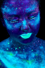 UV painting of a universe on a female body portrait