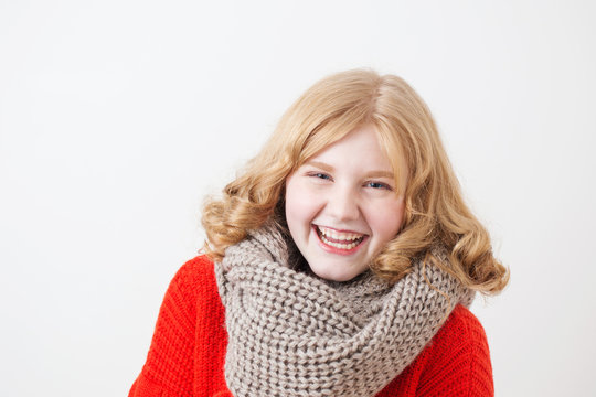 teen girl in red sweater on white background