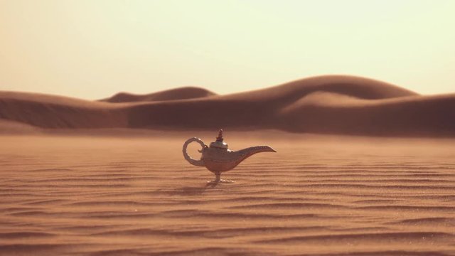 Aladdin magic lamp on a desert. Strong wind in the desert.