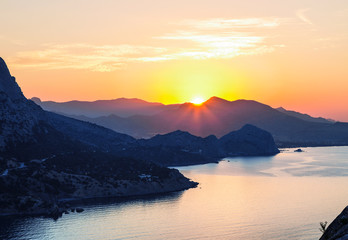 Sunrise, view from Koba Kaya mountain to the surrounding mountains and the Black sea. Crimea, Russia