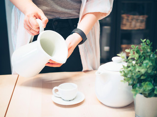 woman power with owner business and hobby lifestyle concept from beauty hand hold white jar and cup for serve coffee or hot drink in restaurant with copy space
