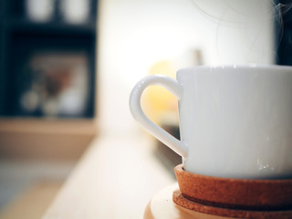 business and job for small business in labor day from service and serve hot coffee or tea in white coffee cup with soft focus shop background