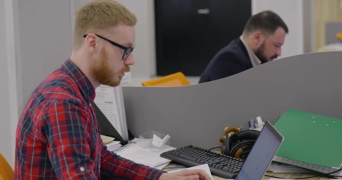 Hipster employee is stressed from work