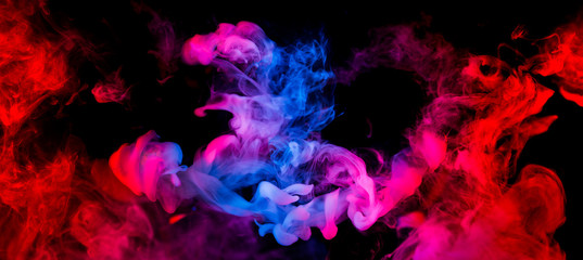 fusion of blue and red smoke in motion isolated on black background