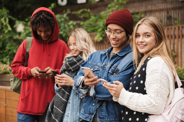 Group if cheerful multiethnic friends teenagers
