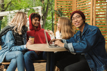 Group if cheerful multiethnic friends teenagers