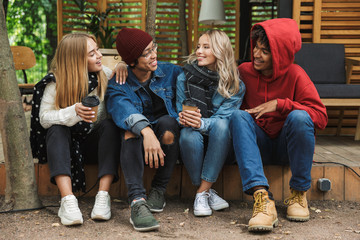 Group if cheerful multiethnic friends teenagers