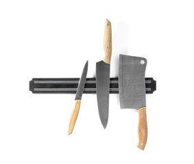 Magnetic holder with different knives isolated on white