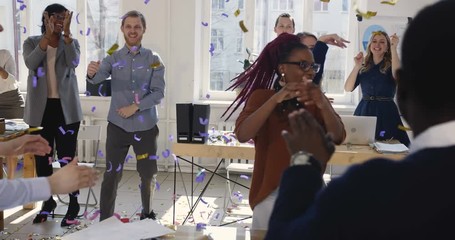 Healthy multiethnic workplace. Fun happy diverse business women doing celebration confetti dance at office workplace.