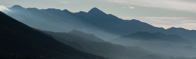 Scenic landscape of mountain shapes. Foggy mountain range. Albania