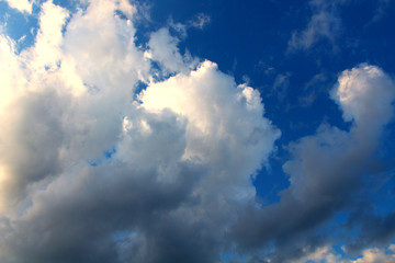 Cumulus clouds with rain. Close-up. Background. Landscape.